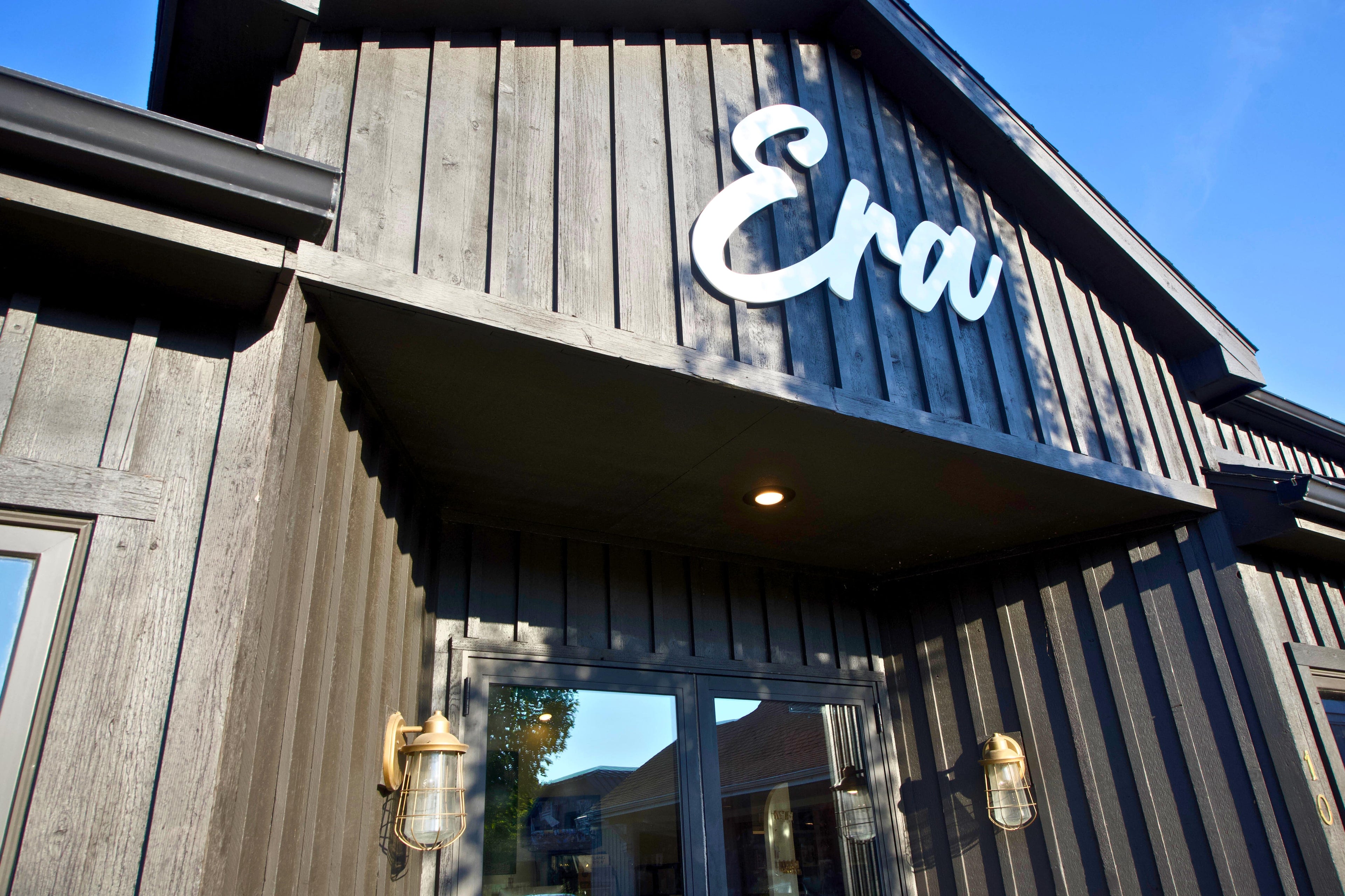 Building exterior with 'Era' logo on a wooden facade
